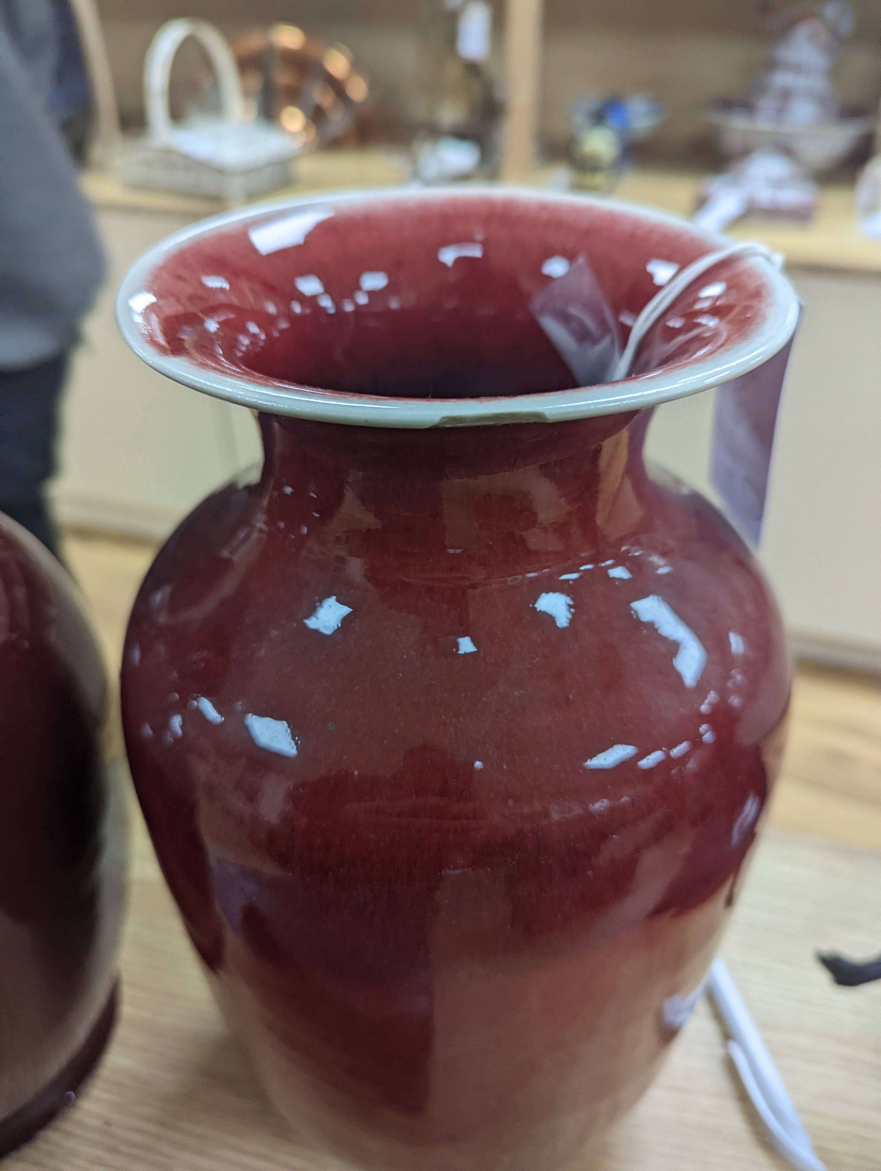 Two large Chinese sang de boeuf glazed vases tallest 36cm